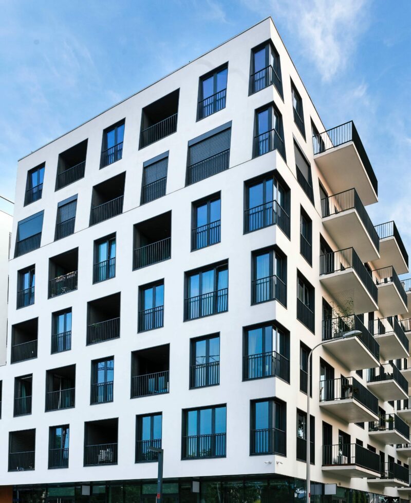 Professional Commercial Roofing Services 127 Restoration apartment building with new roof