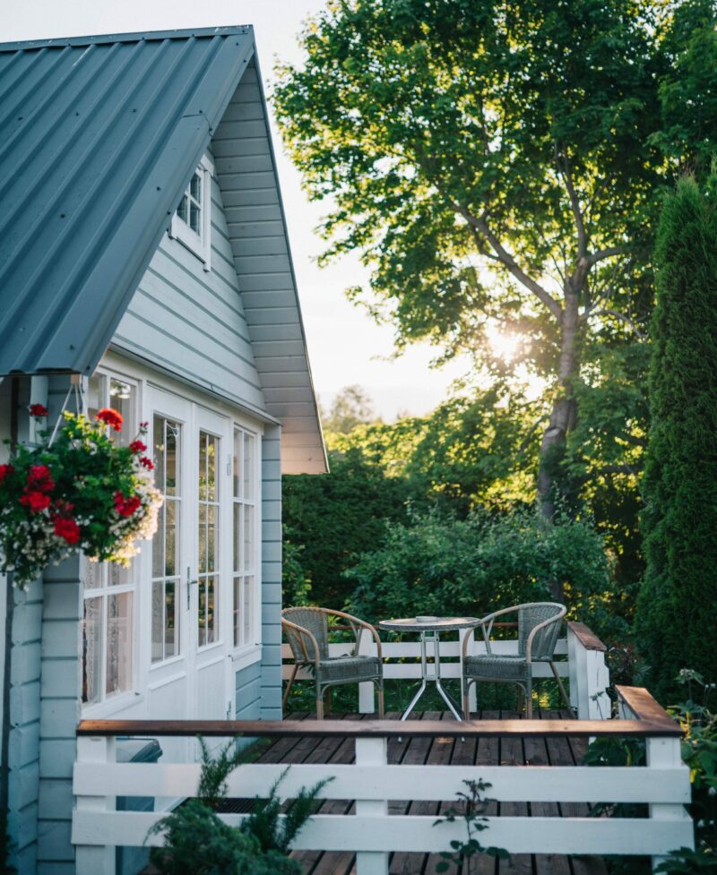 Professional Kitchen Roofing by 127 Restoration Beautiful home with metal roof and patio deck