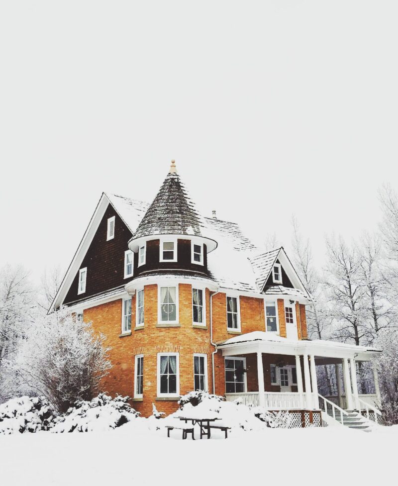 victorian house covered in snow victorian house covered in snow