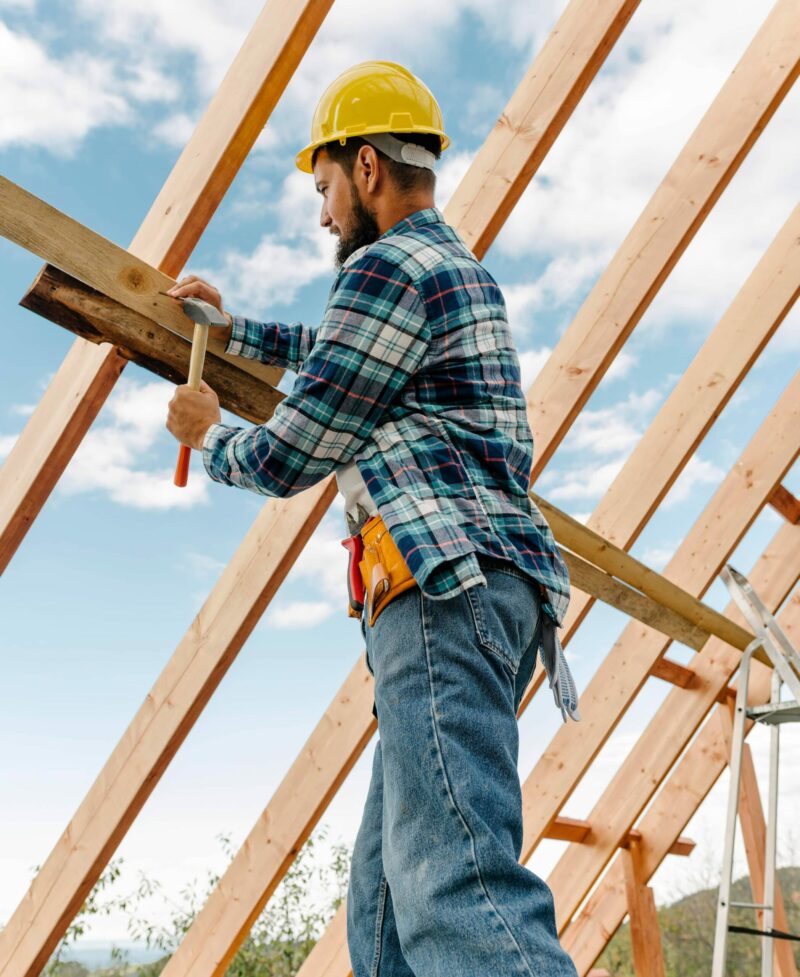 KB Construction employee framing roof KB Construction employee framing roof