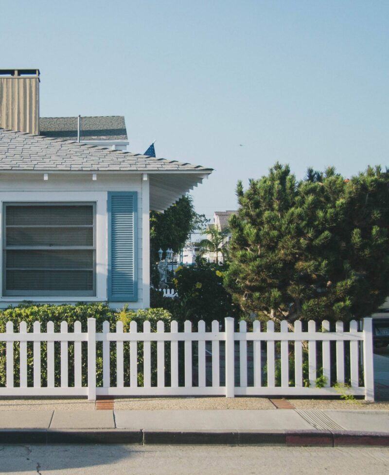Professional Fence Installation by 127 Restoration cute bunaglow with white picket fence