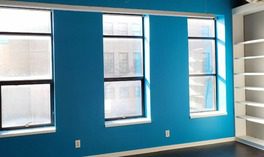 beautiful-blue-paint-accent-wall-in-conference-room-scaled-e1645470716397 Office conference room with bight blue paint